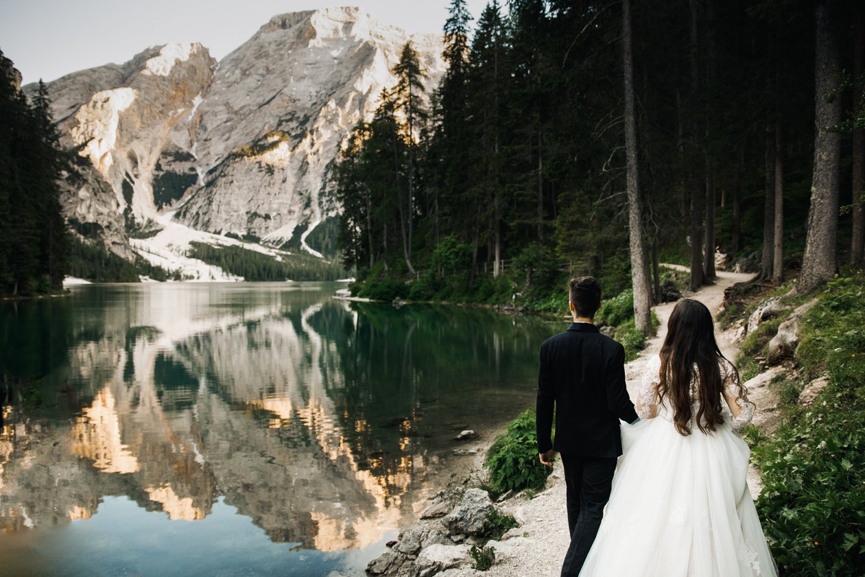 Newly Wed Couple Walking Near Lake